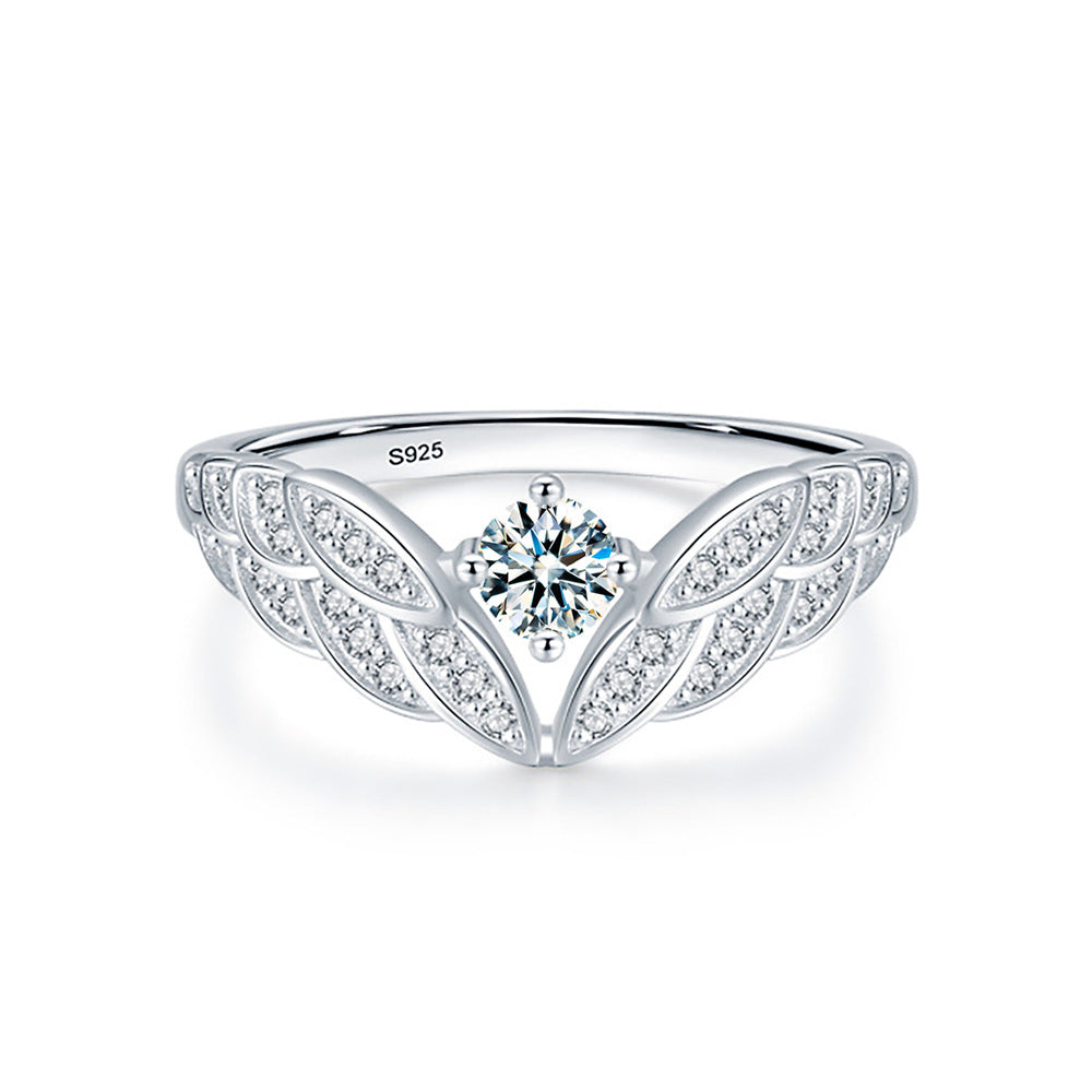 Wings of Serenity – A Blue-Green Moissanite Ring of Heavenly Grace